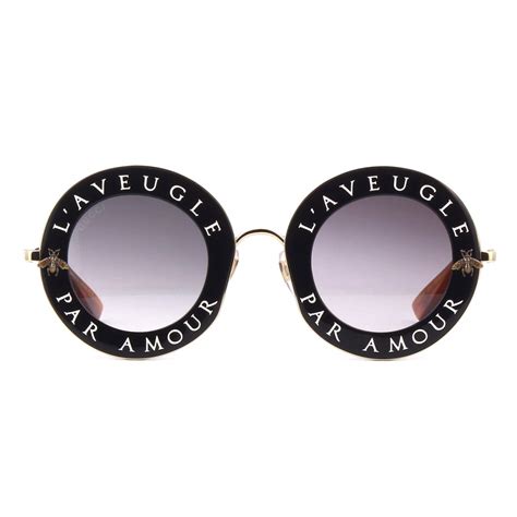 occhiali da sole gucci rotondi logo
